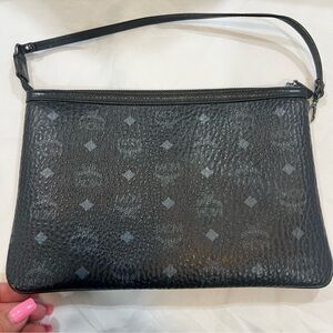Rare!  Reversible MCM Black Monogram Clutch in excellent condition.😍